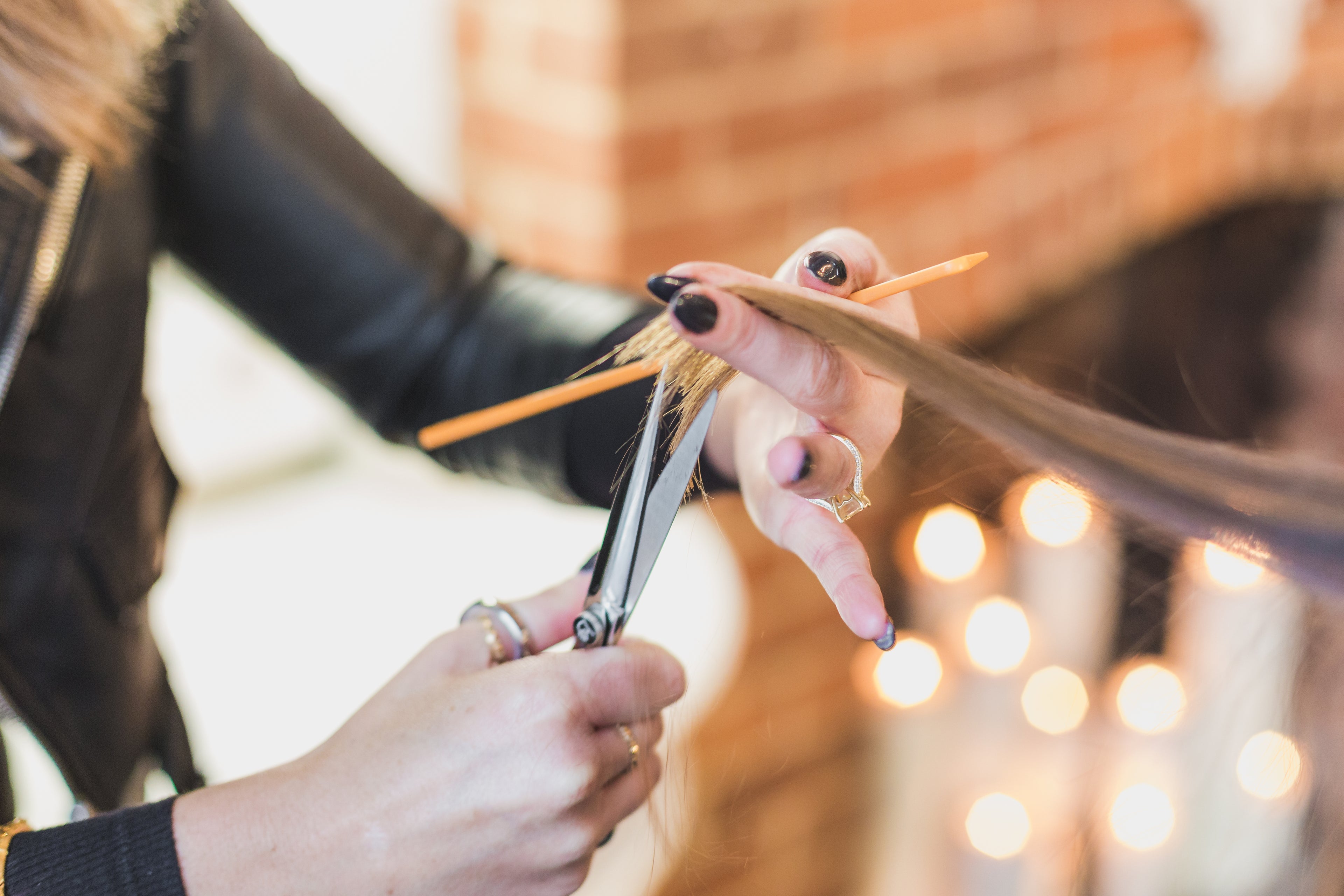 woman cutting hair at salon